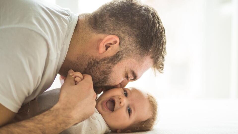 Happy father playing with his daughter