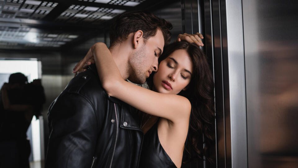 Passionate,Man,In,Black,Jacket,Embracing,Sexy,Woman,With,Closed