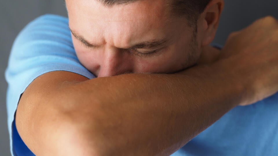 Close-up.,Caucasian,Male,Coughs,In,His,Elbow.,Correct,Sneezing.,Concept