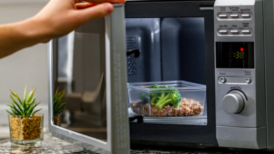 Using,The,Microwave,Oven,To,Heat,Food.,Heating,Plastic,Container