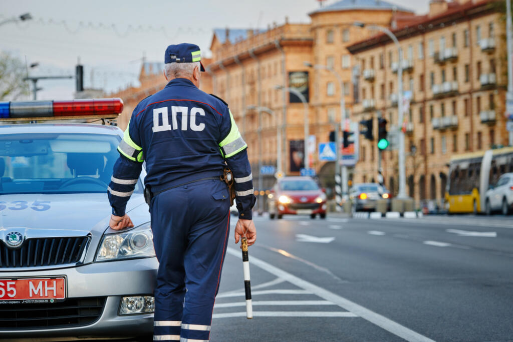 Minsk, Belarus - Apr 2019. Inspector of the road police patrol in the center of Minsk. Traffic police regulate movement of transport. Regulation and prevention offenses. DPS officer with police stick