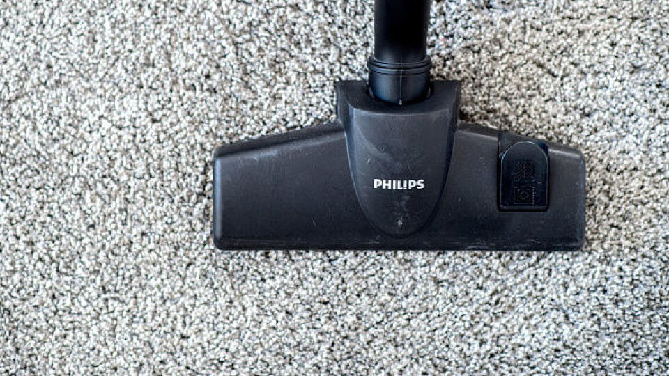 07 March 2019, Lower Saxony, Hannover: A woman in an apartment is vacuuming the floor with a Philips vacuum cleaner. Photo: Hauke-Christian Dittrich/dpa (Photo by Hauke-Christian Dittrich/picture alliance via Getty Images)