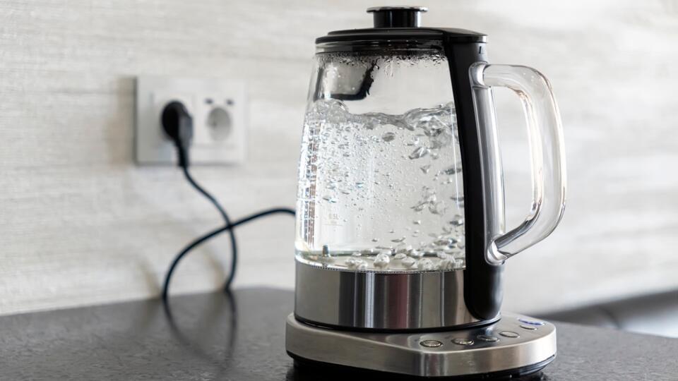 Transparent,Electric,Kettle,With,Boiling,Water,On,Table,In,The