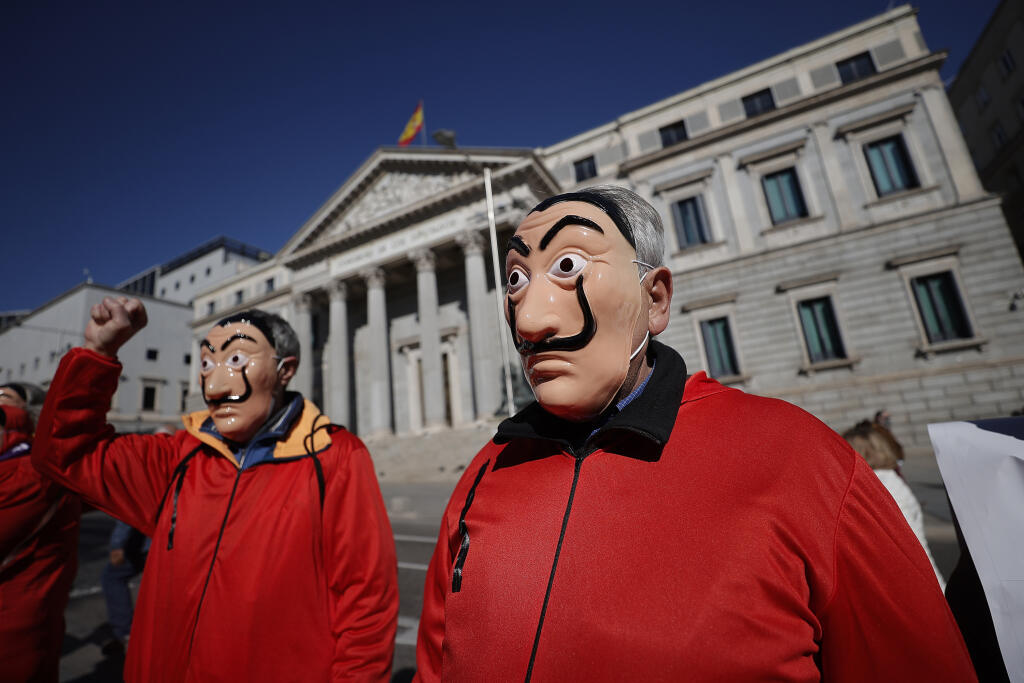 Pensioners, wearing series La Casa de Papel costumes, gather for protest in Spain