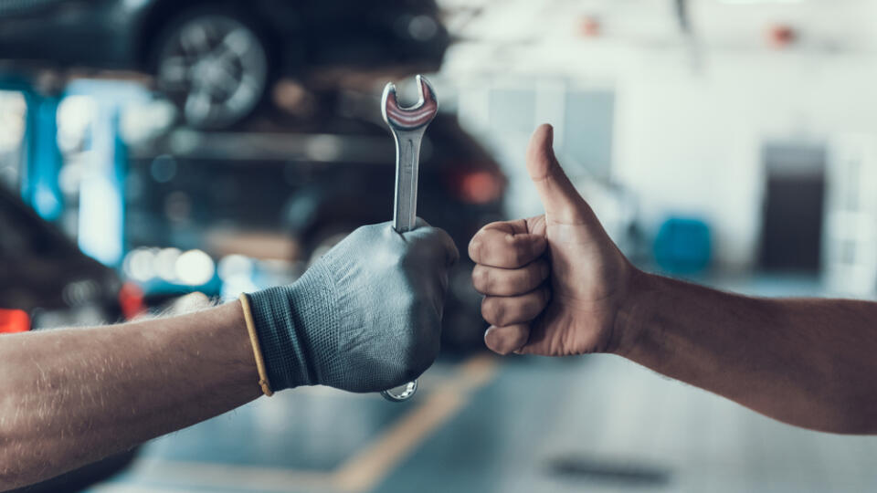 Close-up,Thumb,Up,And,Mechanics,Hand,With,Tool.,Automobile,Master