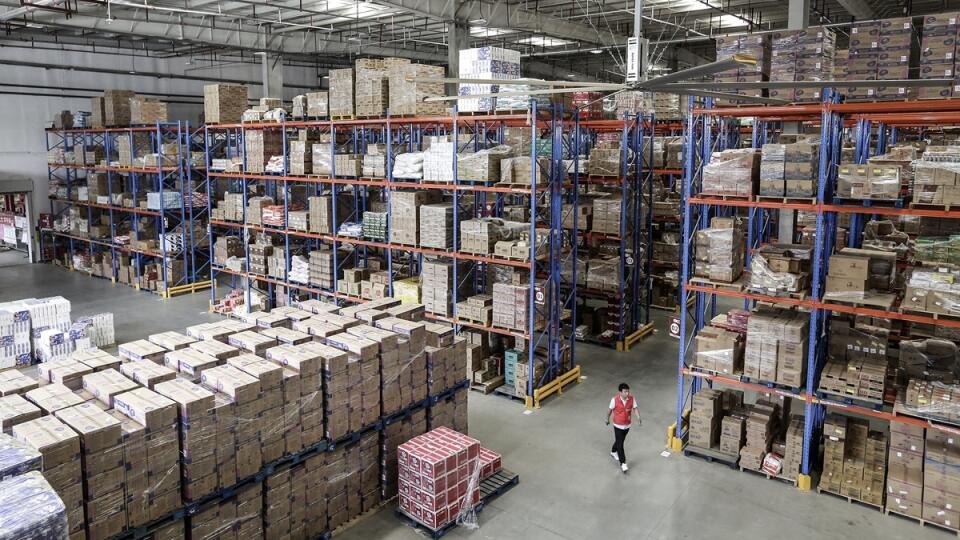 WUHAN, CHINA - NOVEMBER 05: (CHINA OUT) An employee pass at the warehouse of a logistics base of JingDong Group on November 5,2019 in Wuhan, Hubei province.China. ahead of the Double 11 Shopping Festival more scientific and technological equipment was applied to the logistics express production line.China Post website said that 2019 Double 11 Shopping Festival will be from November 11 to 18, and the express business will reach 2.8 billion.(Photo by Wang He/Getty Images)