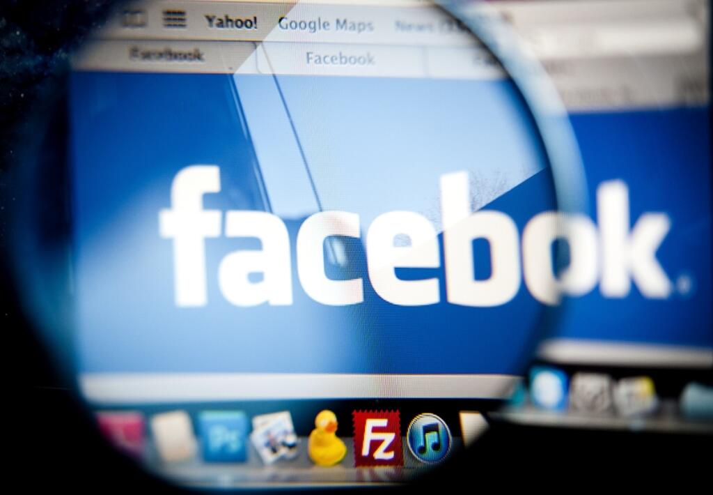 FILE - This Feb. 1, 2012 photo shows the Facebook logo on a computer screen in Berlin. A published report says Facebook is seeking a valuation of $85 billion to $95 billion when it goes public in a few weeks. The Wall Street Journal, citing unnamed people familiar with the matter, said Thursday May 3, 2012 that the company plans to set the per-share price of its stock in the high $20s to mid $30s. This is a narrower range than the previously expected $75 billion to $100 billion. Facebook's initi