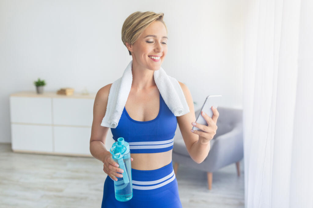 Taking,Break.,Happy,Blonde,Woman,With,White,Towel,On,Shoulders