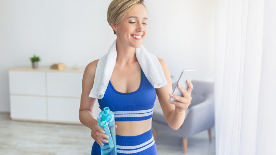 Taking,Break.,Happy,Blonde,Woman,With,White,Towel,On,Shoulders