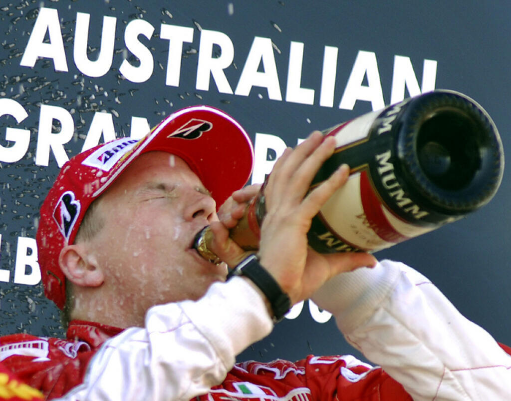 Finnish Ferrari Formula One driver Kimi Raikkonen drinks champagne as he celebrates his victory in the Australian Grand Prix in Melbourne, Sunday, March 18, 2007. (AP Photo/Steve Holland)