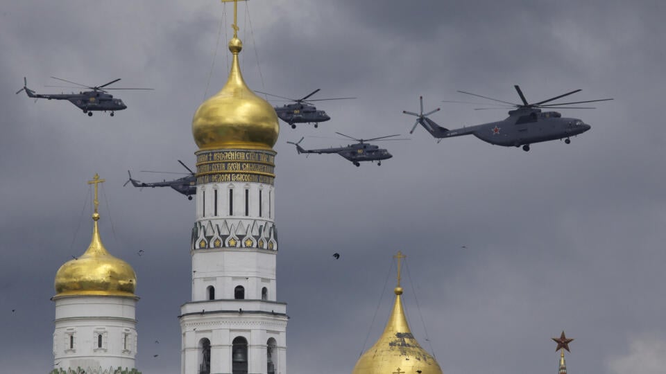 Russian military helicopters fly over Ivan the Great bell-tower and Moscow's Kremlin during a general rehearsal for the Victory Day military parade which will take place at Moscow's Red Square on May 9 to celebrate 71 years after the victory in WWII in Moscow, Russia, on Thursday, May 5, 2016. (AP Photo/Ivan Sekretarev)