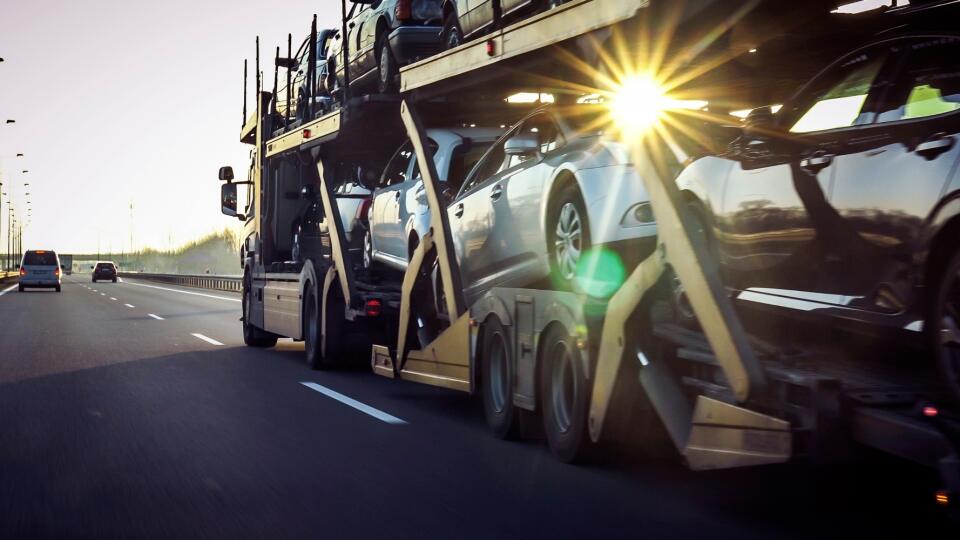 Car,Transporter,Trailer,Loaded,With,Many,Cars,On,A,Highway,