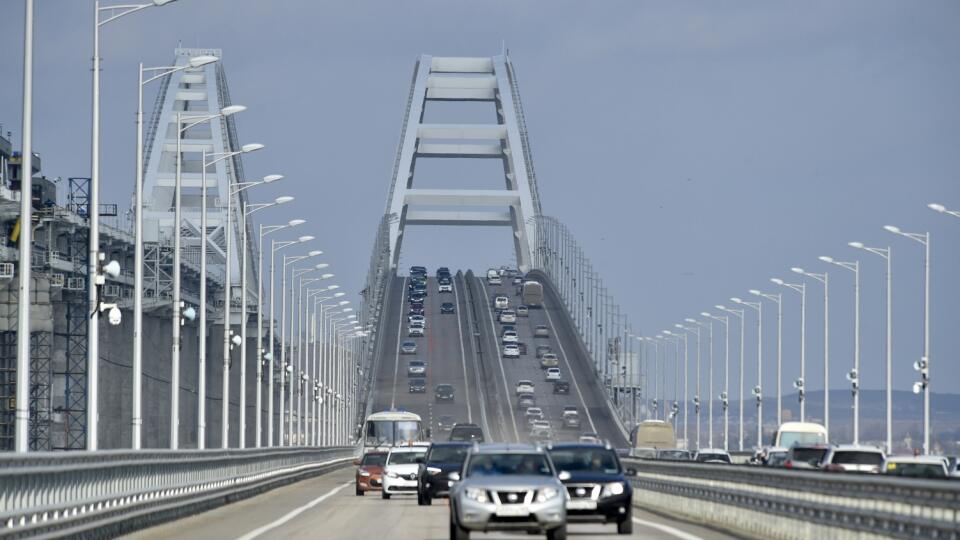 Cars drive over the Crimean Bridge connecting the Russian mainland to the annexed Ukrainian peninsula of Crimea near Kerch on February 23, 2023.