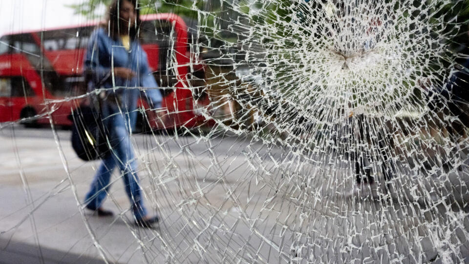 Smashed Window And Passer-By