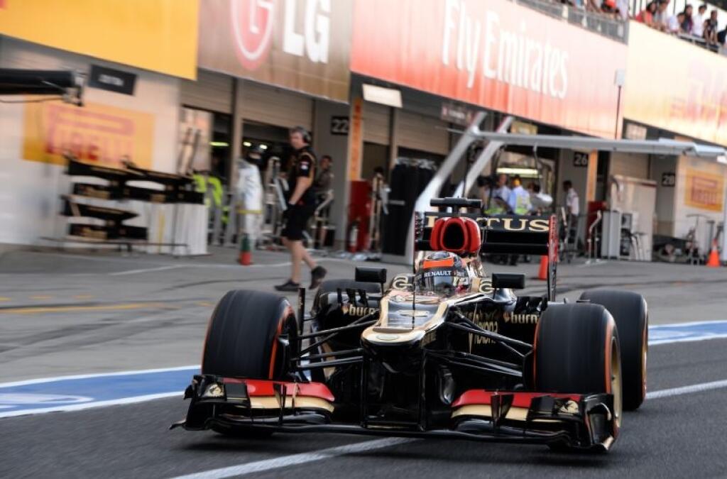 Lotus driver Kimi Raikkonen of Finland leaves his pit during the qualifying session for the Japanese Formula One Grand Prix at the Suzuka circuit in Suzuka, Japan, Saturday, Oct. 12, 2013. (AP Photo/Toshifumi Kitamura, Pool)
