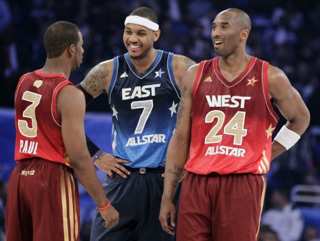 Western Conference's Chris Paul (3), of the Los Angeles Clippers, Eastern Conference's Carmelo Anthony (7), of the New York Knicks, and Western Conference's Kobe Bryant (24), of the Los Angeles Lakers, talk before the NBA All-Star basketball game, Sunday, Feb. 26, 2012, in Orlando, Fla. (AP Photo/Chris O'Meara)