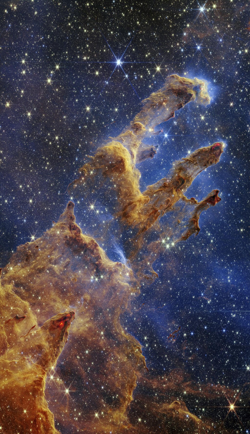 Na snímke poskytnutej americkým Národným úradom pre letectvo a vesmír (NASA) 19. októbra 2022 sú Stĺpy stvorenia ako súčasť Orlej hmloviny zachytené vesmírnym teleskopom Jamesa Webba v takmer infračervenom svetle. FOTO