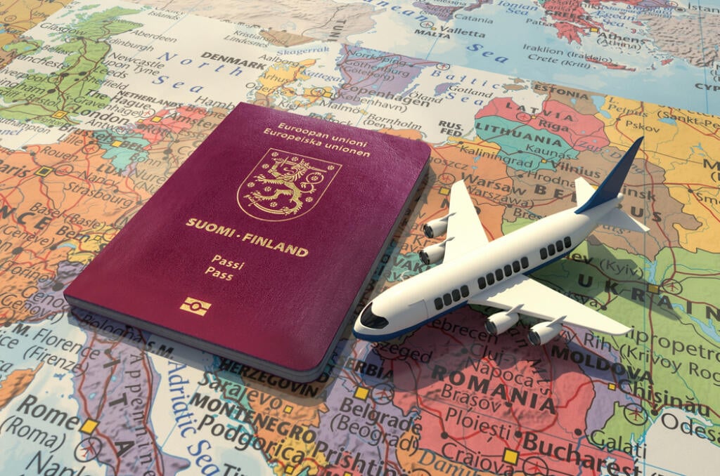 Finnish Passport and an airplane on world map 3D Illustration - Finland