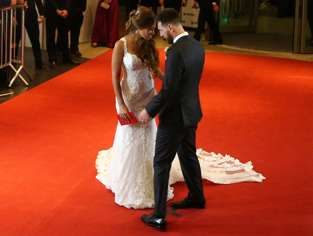 Argentine soccer player Lionel Messi and his wife Antonela Roccuzzo pose at their wedding in Rosario