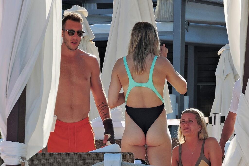 EXCLUSIVE: Tennis star Eugenie Bouchard hits the beach with boyfriend