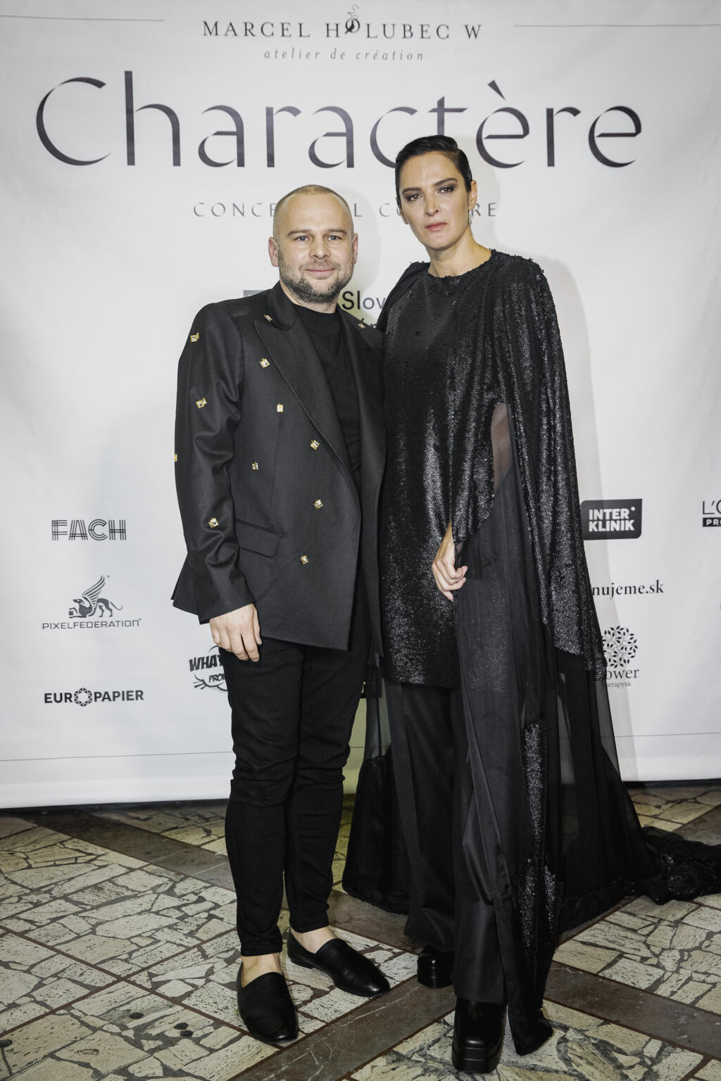 Na snímke Marcel Holubec a Jana Kirschner počas módnej prehliadky Marcela Holubca W s názvom MHW Charactere 2022.