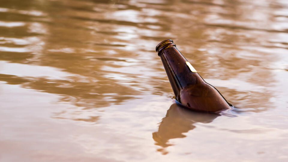 Old,Bottles,Floating,In,The,Water.