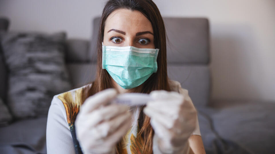 Young,Woman,Measuring,Temperature,At,Home,Isolation,,Wearing,Protective,Mask