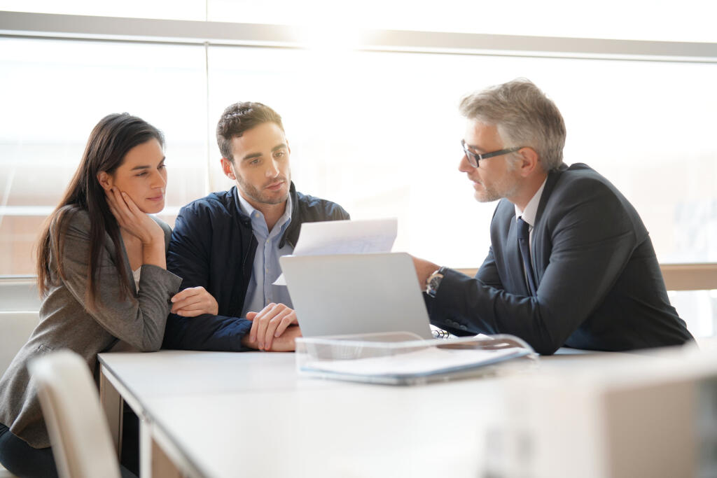 Young,Couple,Meeting,Financial,Advisor,For,Home,Investment