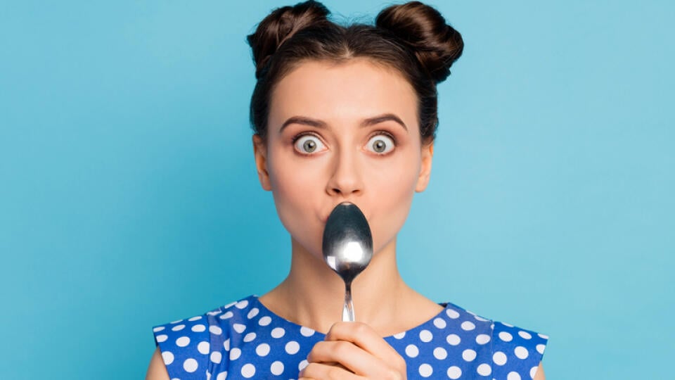 Closeup,Photo,Of,Beautiful,Lady,Holding,Metal,Spoon,Hiding,Mouth