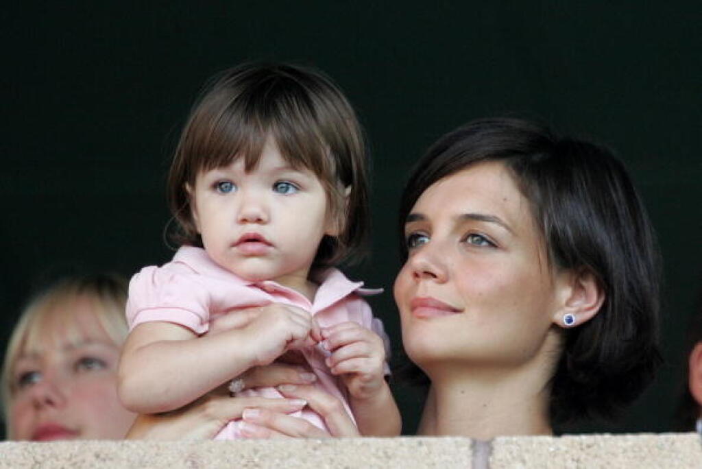 CARSON, CA - JULY 22: Katie Holmes and daughter Suri watch the LA Galaxy vs. Chelsea FC soccer game July 22, 2007 at the Home Depot Center in Carson, California. (Photo by Toby Canham/Getty Images)
