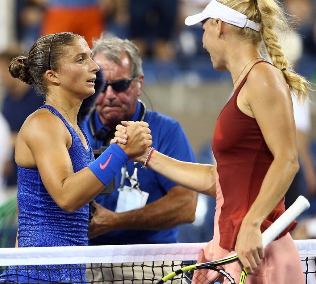 NEW YORK, NY - SEPTEMBER 02: Caroline Wozniacki (R) of Denmark shakes hands with Sara Errani (L) of Italy in their women's singles quarterfinal match on Day Nine of the 2014 US Open at the USTA Billie Jean King National Tennis Center on September 2, 2014 in the Flushing neighborhood of the Queens borough of New York City. (Photo by Streeter Lecka/Getty Images)