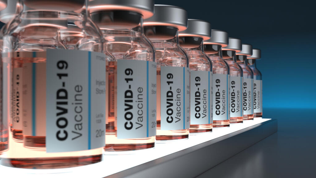 Covid19,Vaccines,Inside,Bottles,On,Light,Base,Abstract,Background
