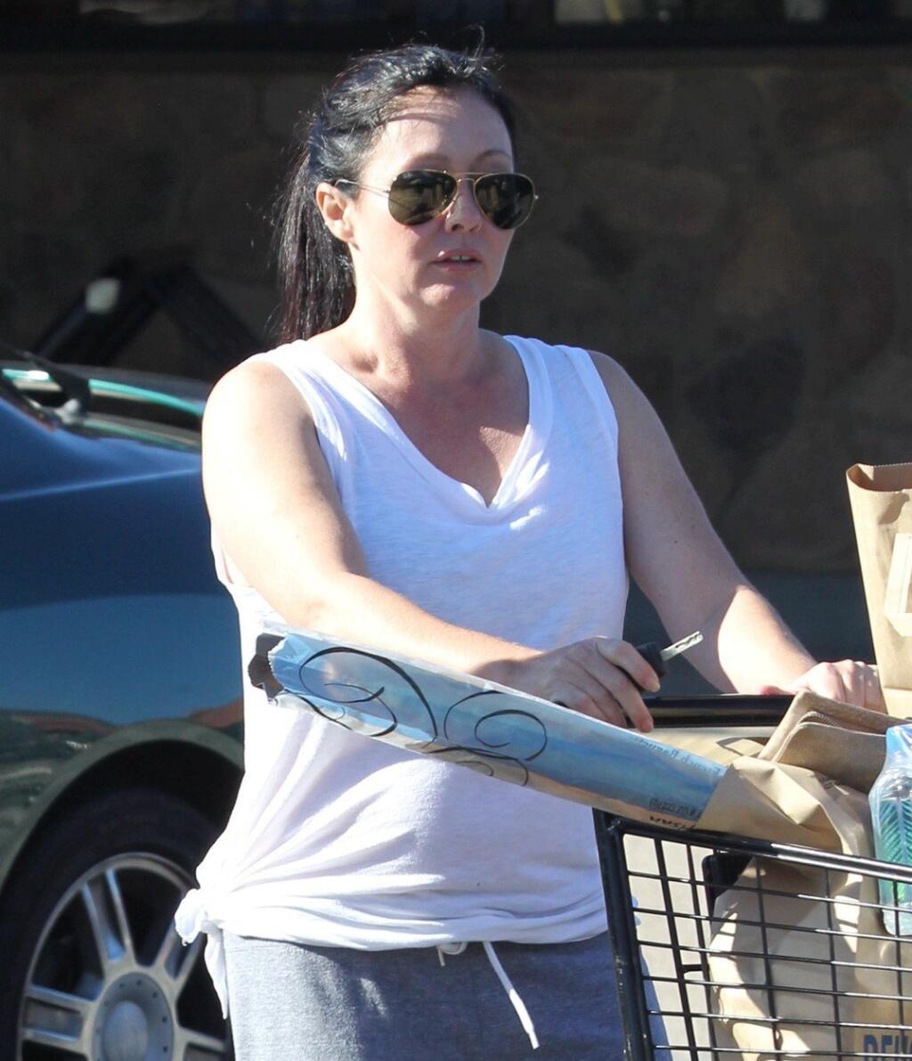 Shannen Doherty gets groceries in Malibu and it looks like she might have a little tummy. The former 90210 star got married to her third husband Kurt Iswarienko last year and maybe they are ready for a family or maybe she's just happy being married? October 16, 2012 EXCLUSIVE, Image: 144199062, License: Rights-managed, Restrictions: , Model Release: no, Credit line: Profimedia, X17