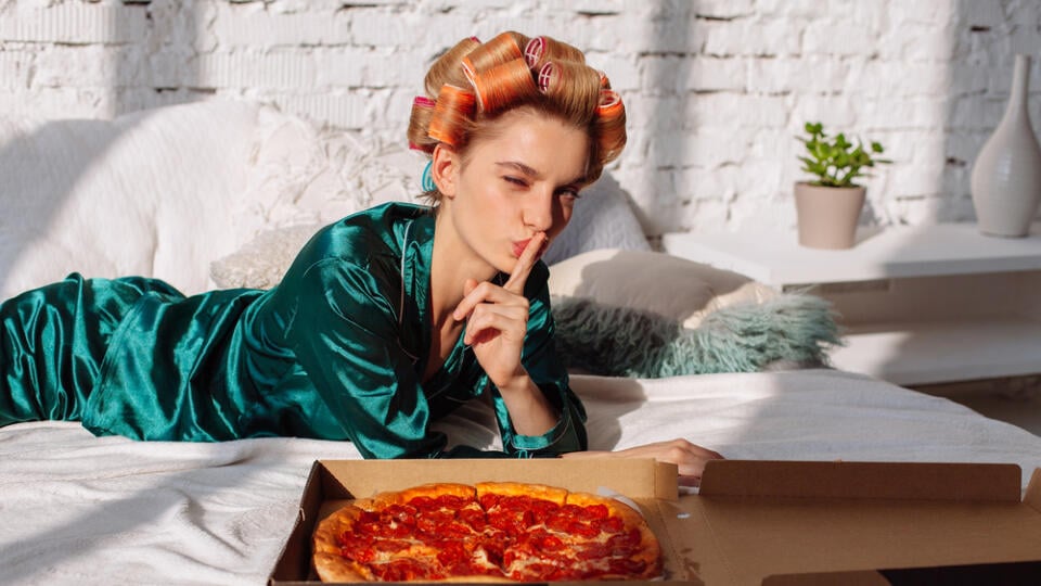 Young,Woman,In,Silk,Pajama,Showing,Silence,Gesture,With,Pizza