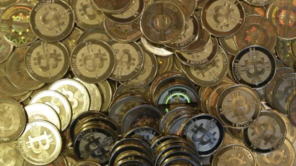 FILE - This April 3, 2013 file photo shows bitcoin tokens in Sandy, Utah. The Tokyo bitcoin exchange Mt. Gox that filed for bankruptcy protection blamed theft through hacking for its losses Monday, March 3, 2014, and said it was looking into a criminal complaint. (AP Photo/Rick Bowmer, File)