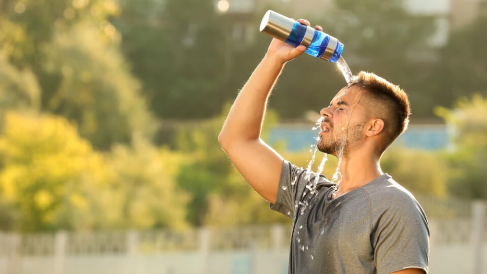 Handsome,Sporty,Man,Refreshing,Himself,With,Water,After,Training,Outdoors