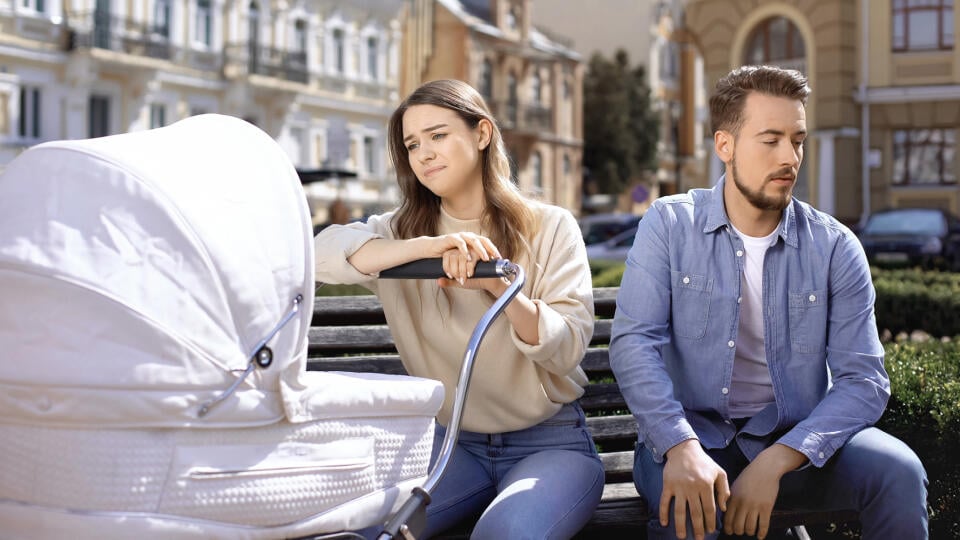 Sad,Parents,Sitting,On,Bench,,Different,Parenting,Styles,Conflict,,Family
