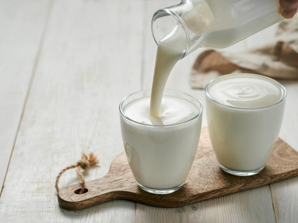 Pouring,Homemade,Kefir,,Buttermilk,Or,Yogurt,With,Probiotics.,Yogurt,Flowing