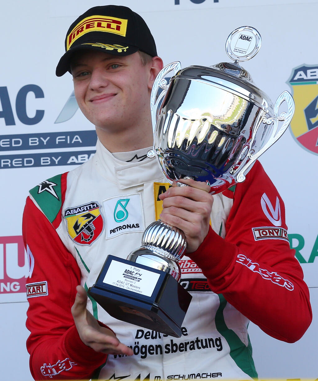 OSCHERSLEBEN, GERMANY - APRIL 17: Mick Schumacher, son of the former F1 champion Michael Schumacher, poses with the trophy after winning the 3rd race during day 3 of the ADAC Formula Four championship at Motorsport Arena Oschersleben on April 17, 2016 in Oschersleben, Germany. (Photo by Matthias Kern/Bongarts/Getty Images)