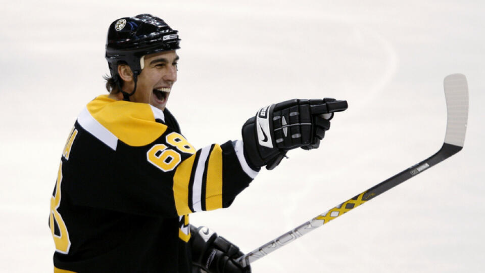 Boston Bruins' Milan Jurcina, of Slovakia, celebrates his winning goal against the Montreal Canadiens during the third period of Boston's 4-2 win in a NHL hockey game in Boston on Saturday, Dec. 23, 2006. (AP Photo/Winslow Townson)