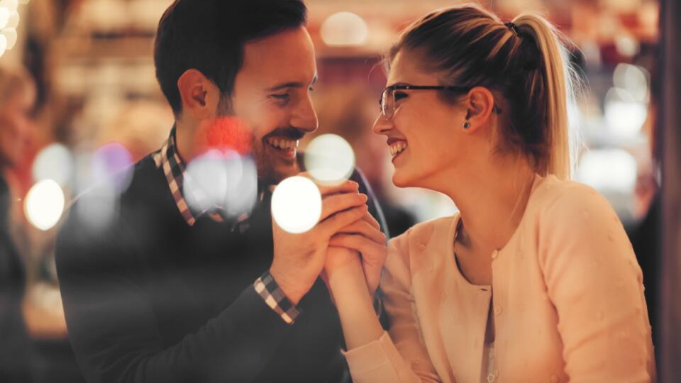 Couple dating at night in pub