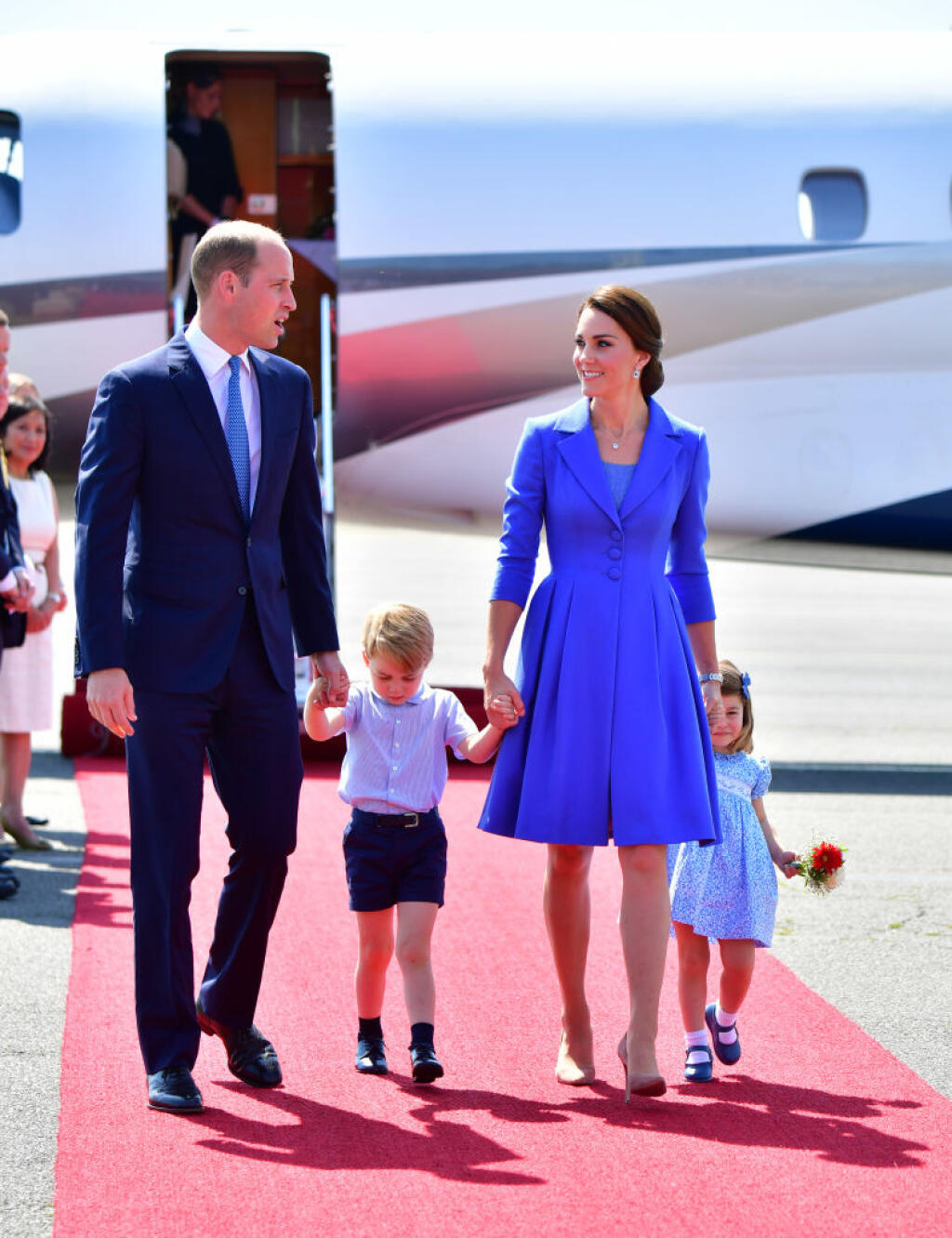 BERLIN, GERMANY - JULY 19: Prince William, Duke of Cambridge, Catherine, Duchess of Cambridge with Prince George of Cambridge and Princess Charlotte of Cambridge as they arrive at Berlin Tegel Airport during an official visit to Poland and Germany on July 19, 2017 in Berlin, Germany. (Photo by Robin Utrecht - Pool/Getty Images)