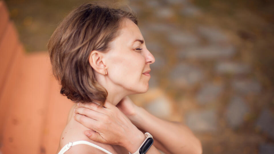 Woman,With,Neck,Pain,In,The,Park.,Healthcare,And,Medicine