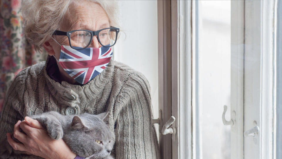 Older,Woman,In,A,Protective,Mask,With,A,British,Flag