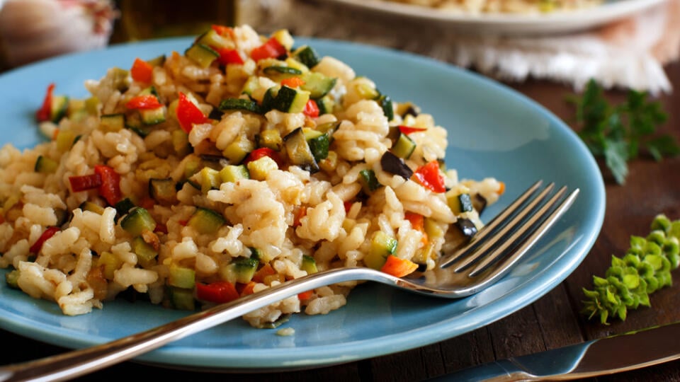 Risotto,With,Vegetables,On,A,Wooden,Table,Close,Up