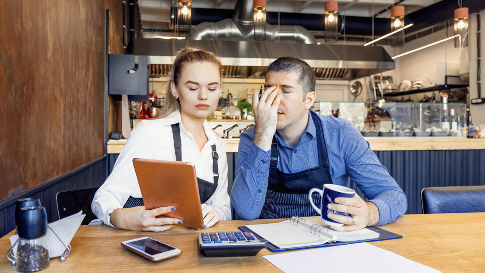 Worried,Owners,In,Empty,Restaurant,Calculating,Finances,-,Coronavirus,Pandemic