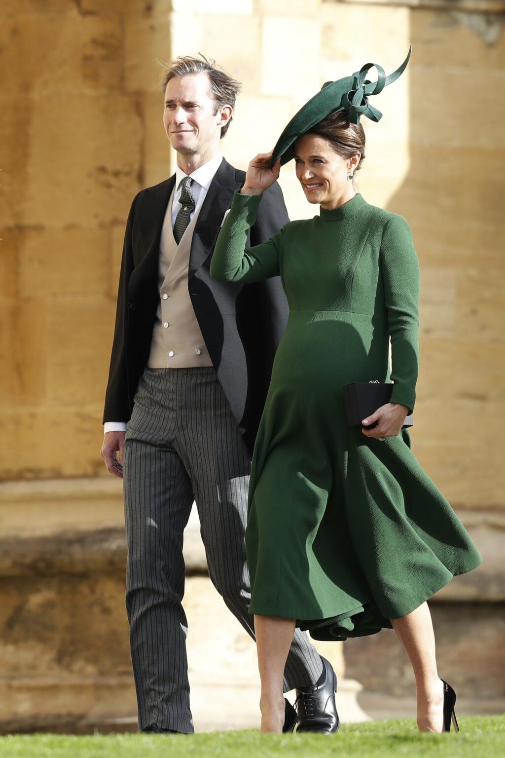 Pippa Matthews and husband James Matthews arrive to attend the wedding of Princess Eugenie of York and Jack Brooksbank at St Georgeâs Chapel, Windsor Castle, near London, England, Friday Oct. 12, 2018. (Adrian Dennis/Pool via AP)
