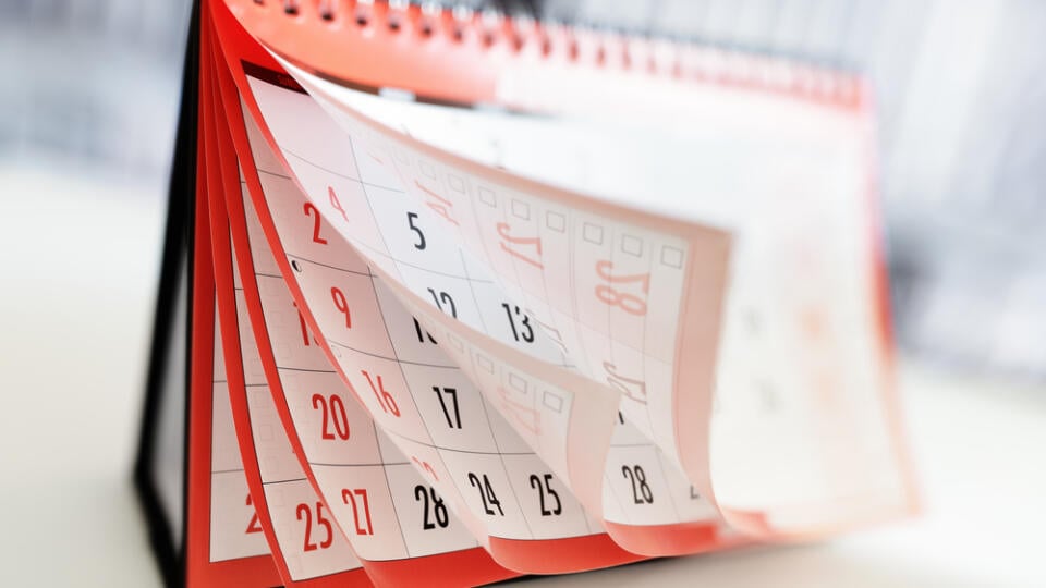 Months,And,Dates,Shown,On,A,Calendar,Whilst,Turning,The