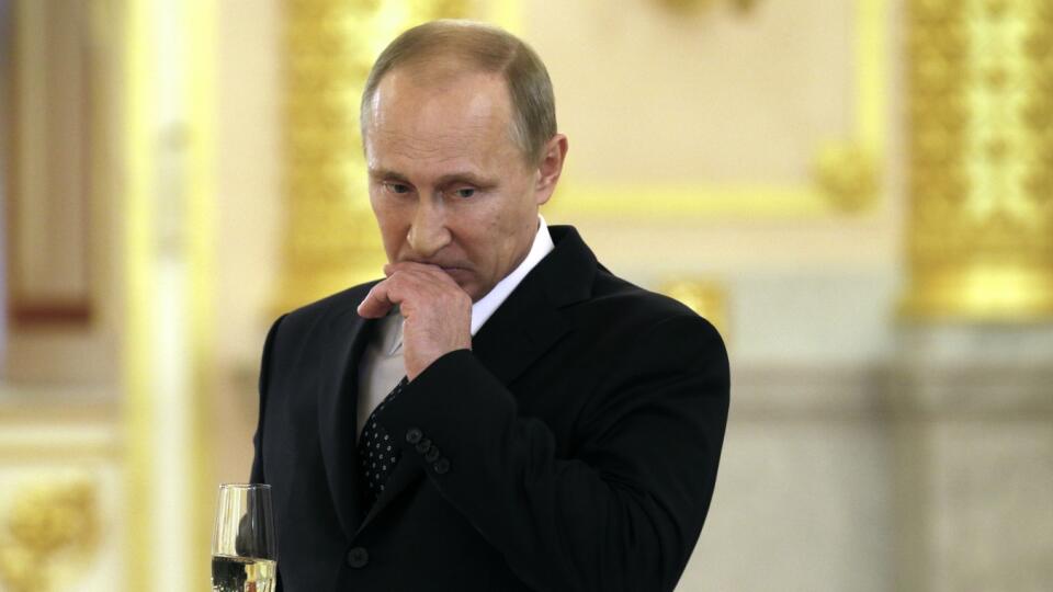 Russian President Vladimir Putin holds a glass of champagne during a credentials ceremony for foreign ambassadors in the Kremlin in Moscow, Russia, Wednesday, Oct. 23, 2013. (AP Photo/Alexander Zemlianichenko)