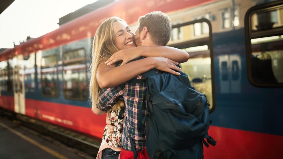 Beautiful couple hugging after long journey